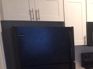 Premium kitchen counter, bright white cabinets, and appliances in Regency apartments Bettendorf, Iowa
